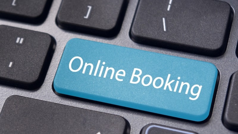 A blue button that says online booking on a keyboard