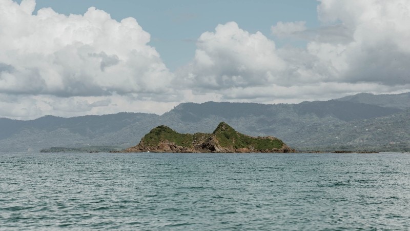 A green island in the middle of the ocean in Costa Rica.
