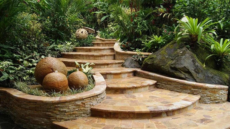 The artfully crafted stone steps to the Shangri La gardens in Costa Rica, framed by water features on either side
