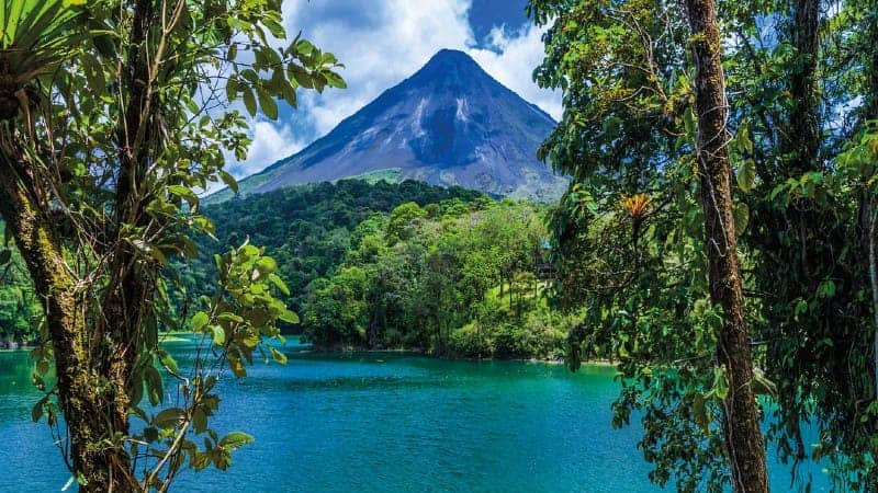 water with volcano in the background in Costa Rica