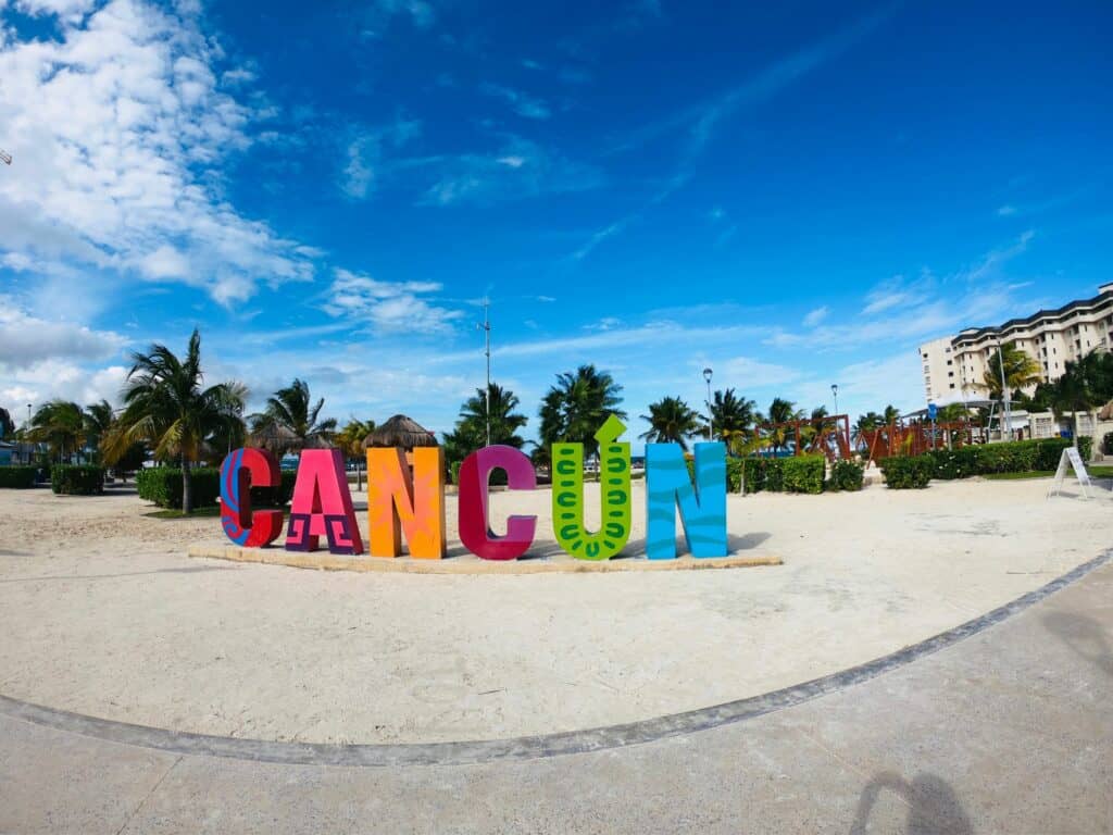 colorful sign that says "Cancun"